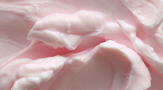 Photo of rich and creamy body butter ready to be scooped out of the jar, ready to be applied to the skin for a nourishing and moisturizing experience 
